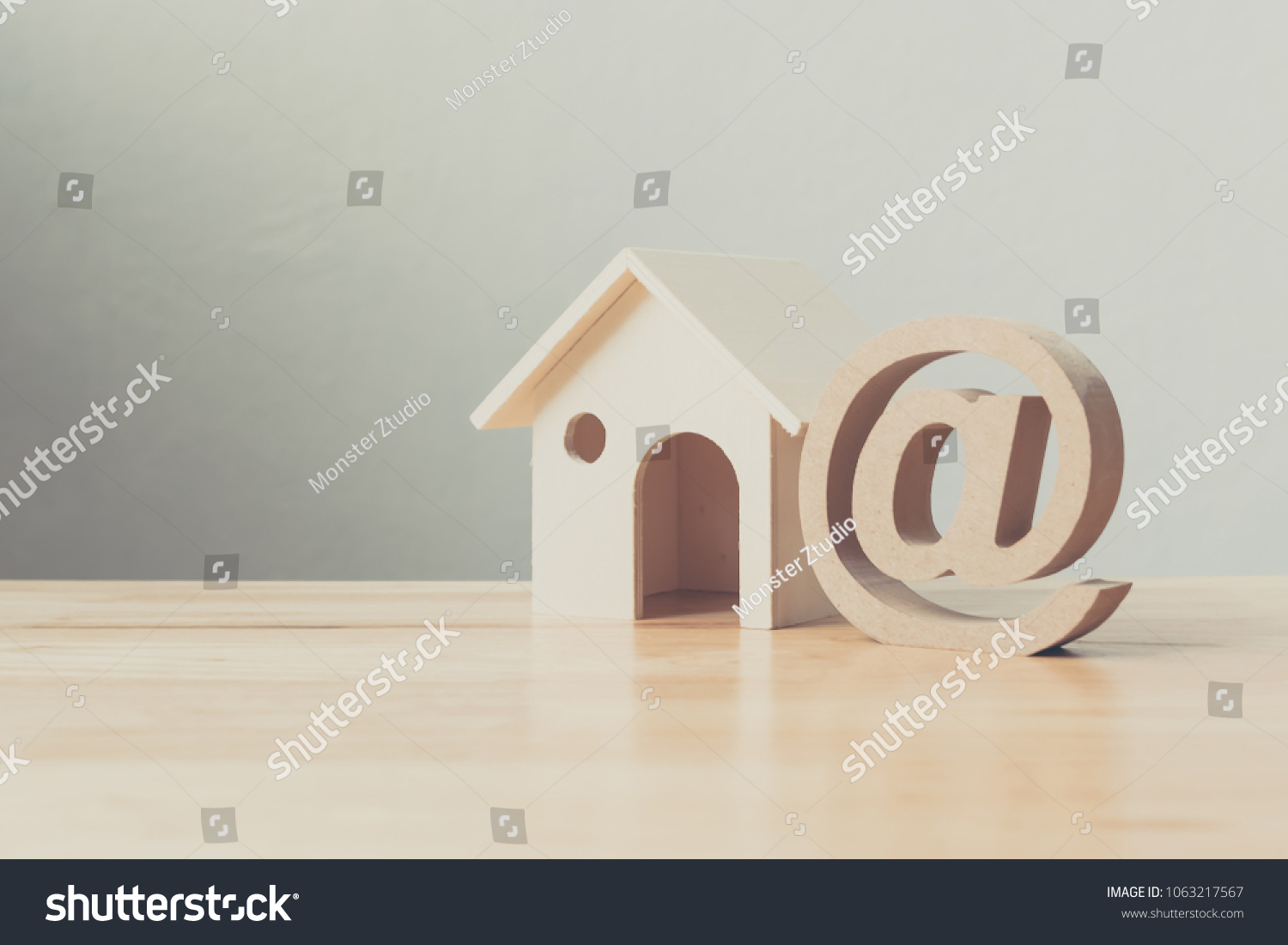 stock-photo-wooden-house-and-address-sign-on-wood-table-email-contact-us-concept-1063217567